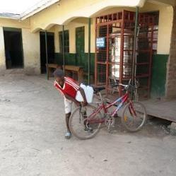 boy fetching drinking water for famuly